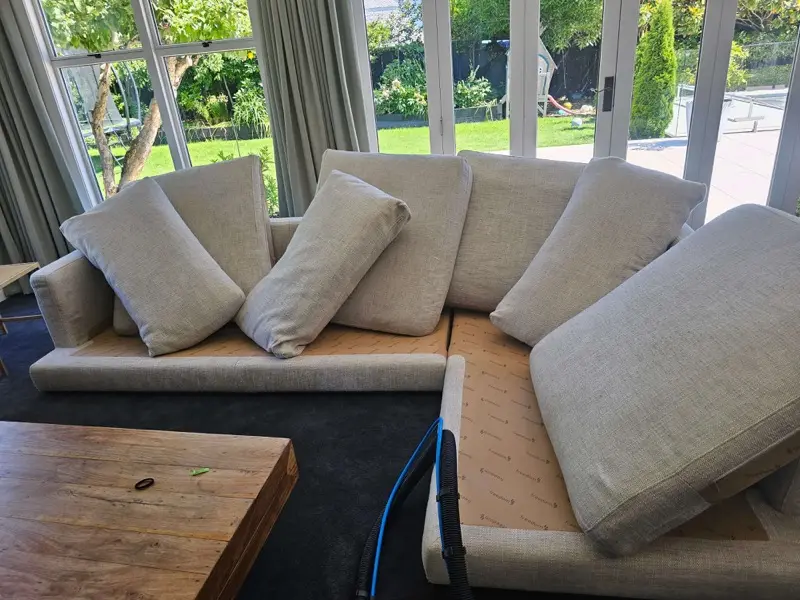 Couch upholstery cleaning in progress by SN Cleaning Services, Christchurch